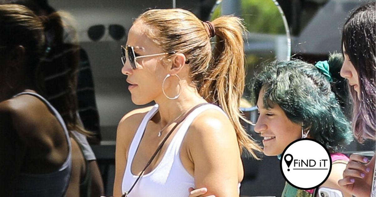 Jennifer Lopez showcases her taut tummy in a sexy cropped tank