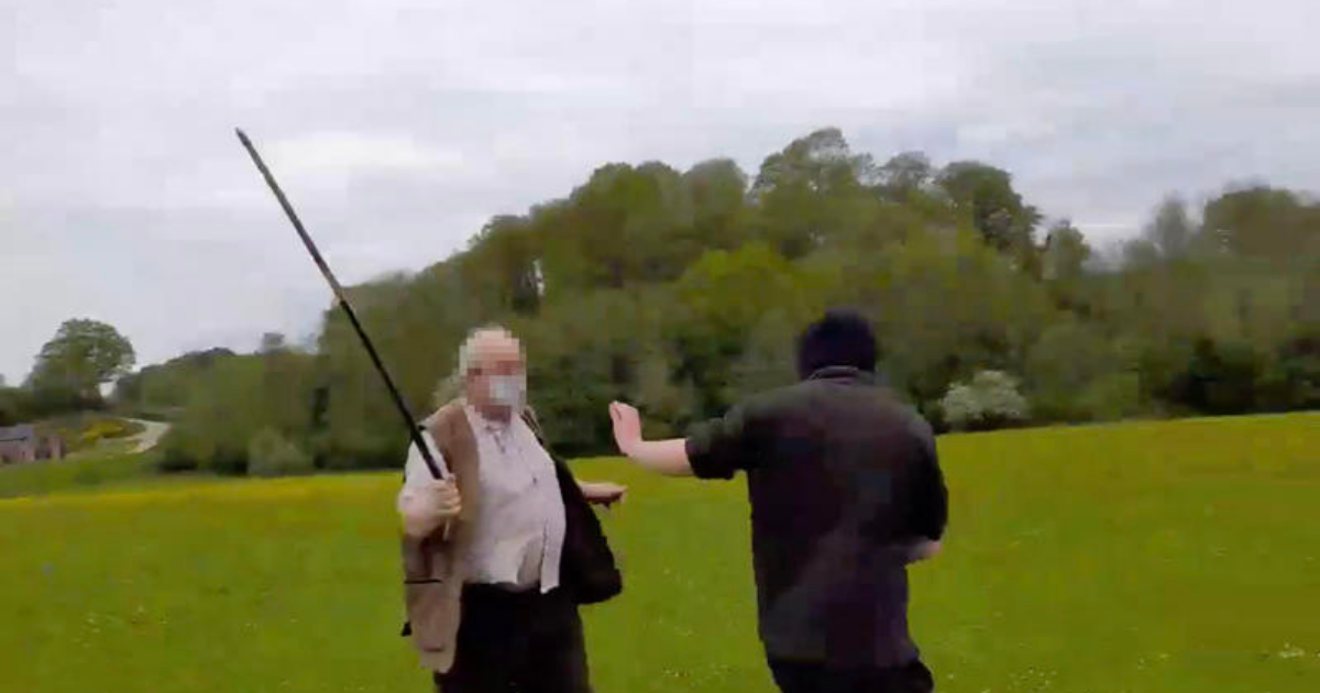 Hunt supporter threatens protester with pole